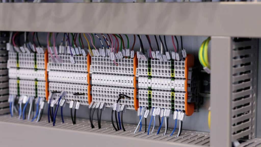 Close-up of an electrical control panel with wiring and terminal blocks.